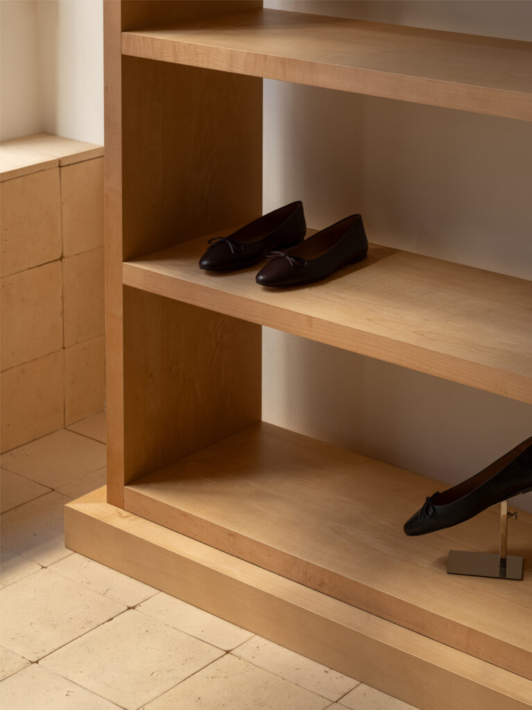 Detail of flattered Flasgship store in Stockholm. Custom made shelves by Studio Escapist